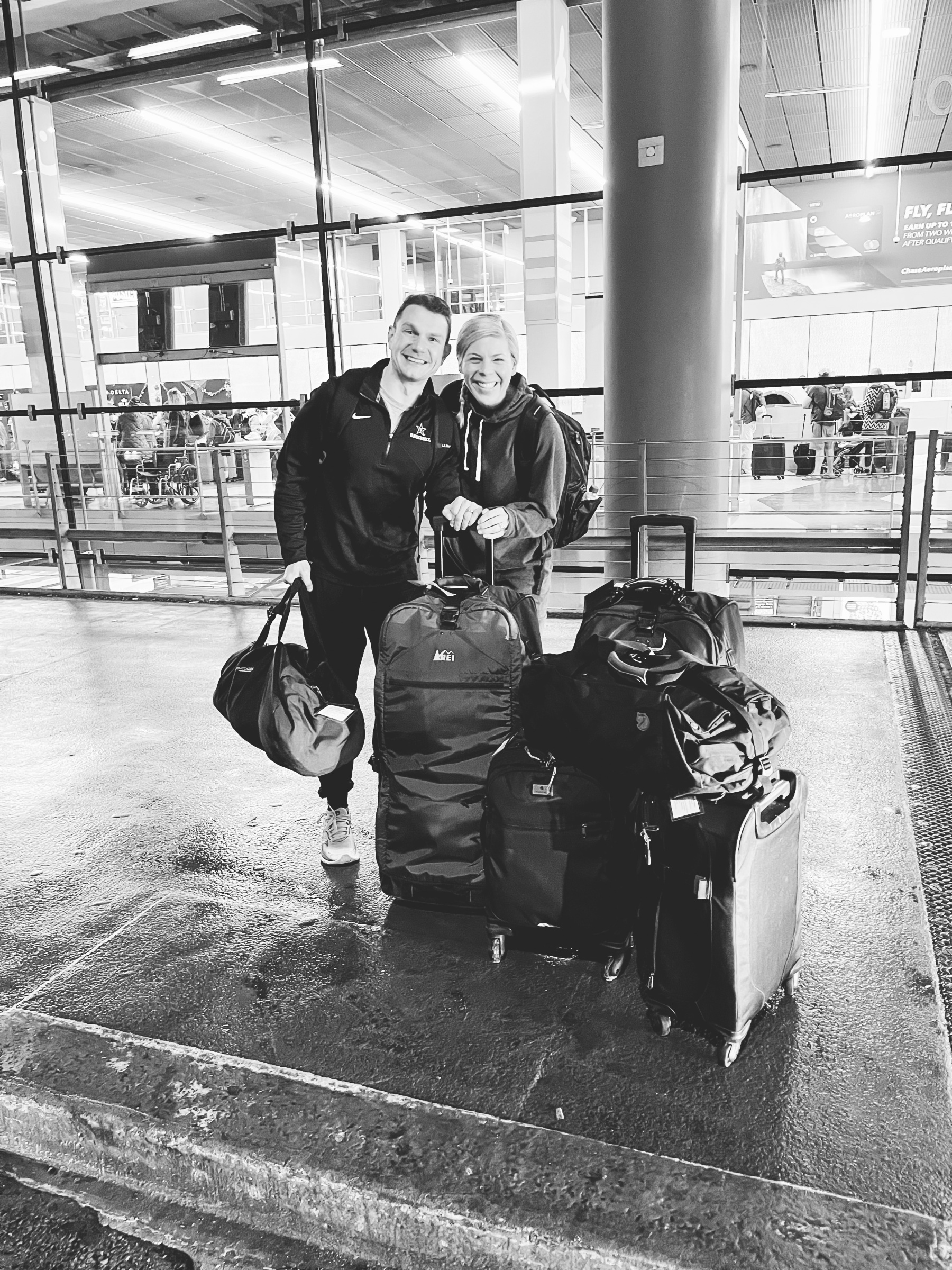 hilari and grant with luggage at ohare airport